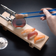 Illustration for article titled Wonderful U.S.S. Enterprise Sushi Set Includes Warp Trail Chopsticks